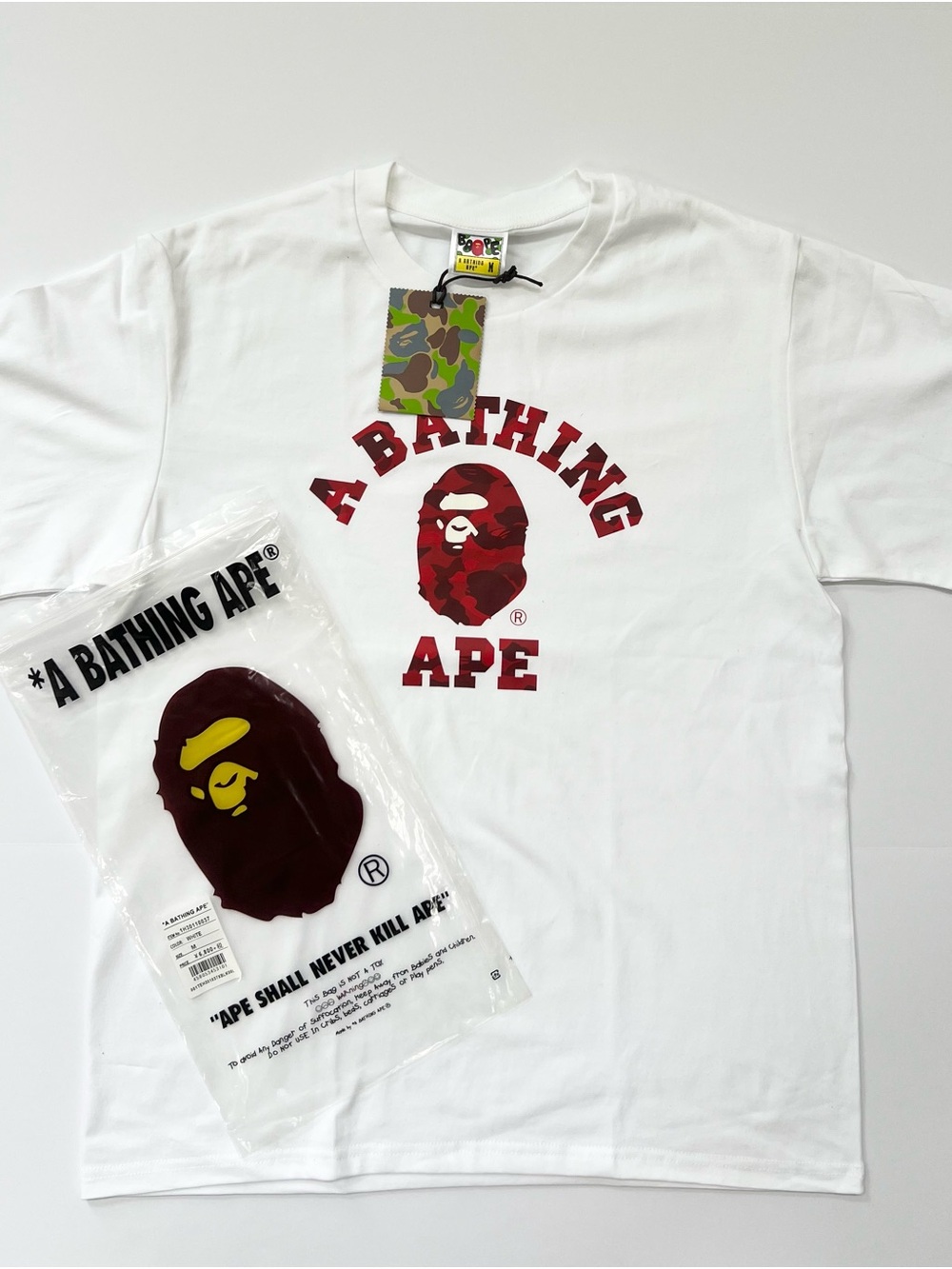 A Bathing Ape White Graphic Tee with Red Logo